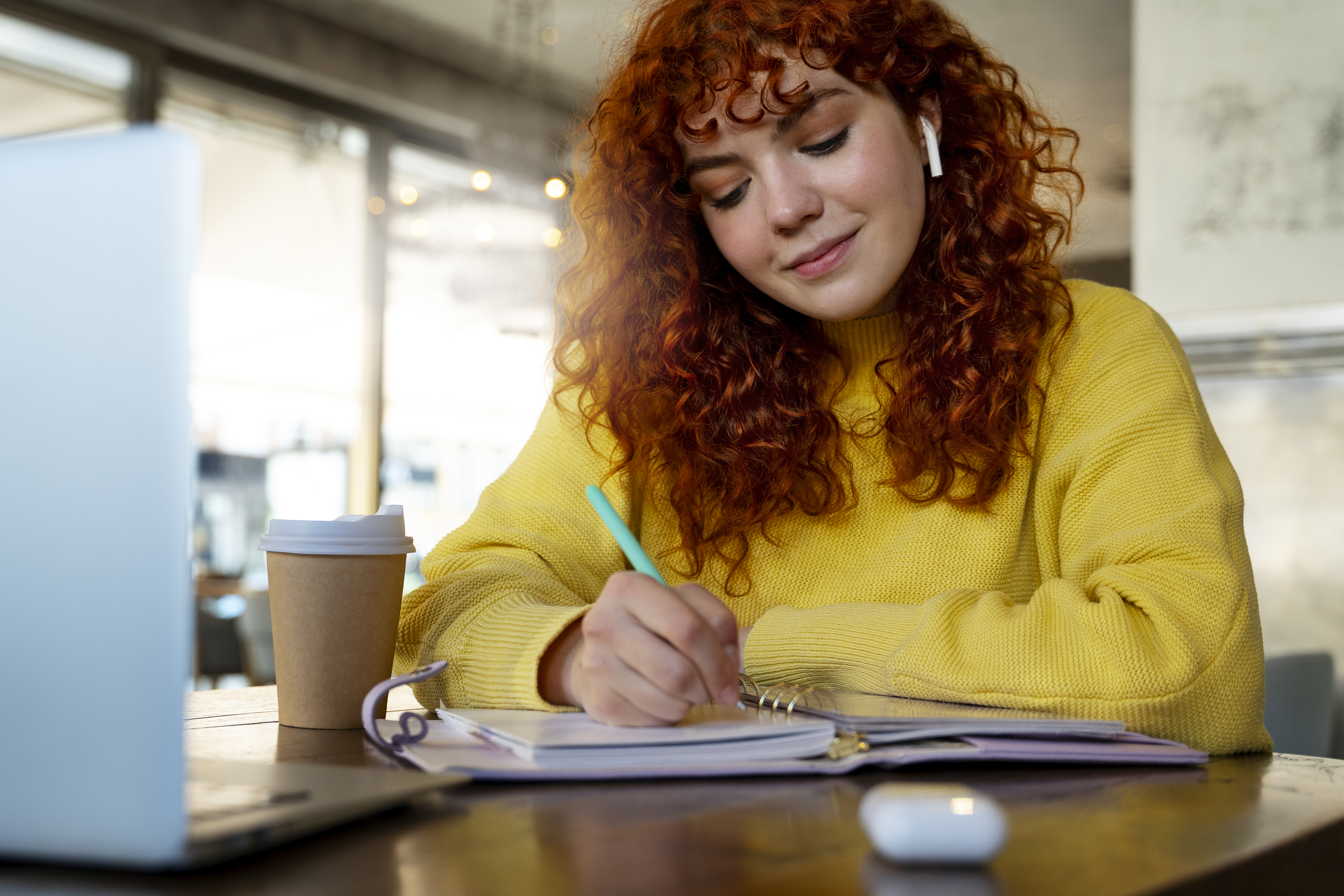 Red-haired Woman studying